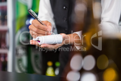 Waiter writing down an order