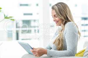 Pregnant woman using digital tablet