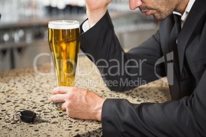 Handsome man having a beer