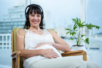 Pregnant woman sitting on chair