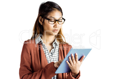 Businesswoman with eyeglasses using a tablet