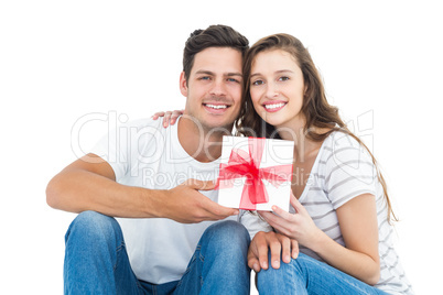 Happy couple receiving a gift