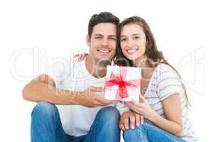 Happy couple receiving a gift