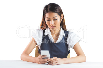 Businesswoman using her smartphone