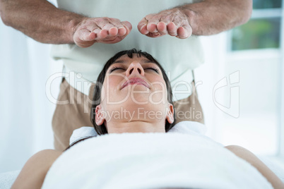 Pregnant woman receiving a massage from masseur