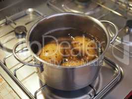 Boiling potato in saucepan