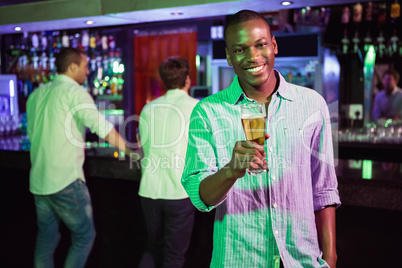 Man posing with glass of beer