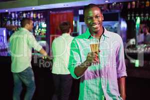 Man posing with glass of beer