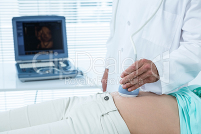 Pregnant woman undergoing ultrasound test