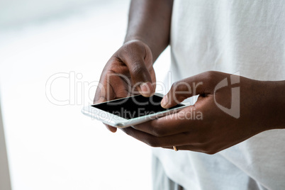 Man text messaging on mobile phone