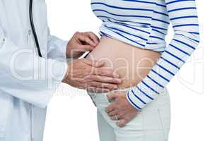 Doctor examining pregnant woman