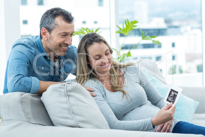 Couple looking at ultrasound scan