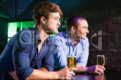 Two men having beer at bar counter