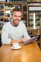 Handsome man using tablet computer