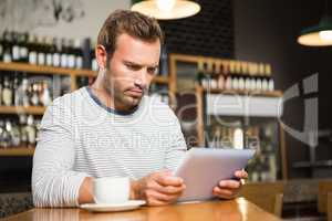 Handsome man using tablet computer