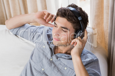 Young man at home relaxing on the sofa