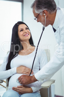 Doctor examining pregnant woman