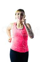 Woman jogging while listening to music