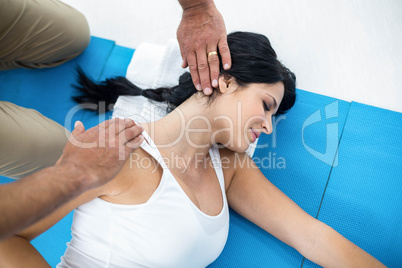 Doctor giving physiotherapy to pregnant woman