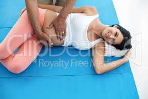 Doctor giving physiotherapy to pregnant woman