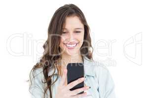 Smiling young woman using her smartphone
