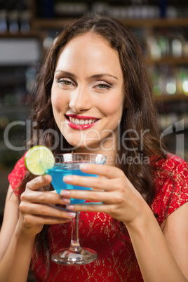 Pretty woman having a cocktail