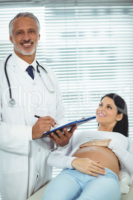 Pregnant woman interacting with doctor