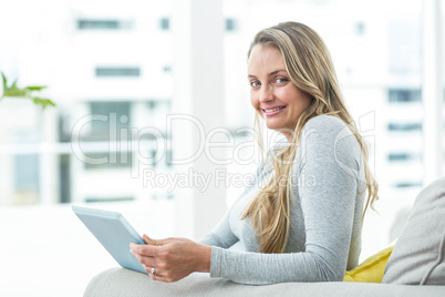 Pregnant woman using digital tablet