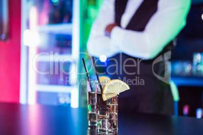 Two glasses of gin on bar counter