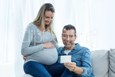 Couple looking at ultrasound scan