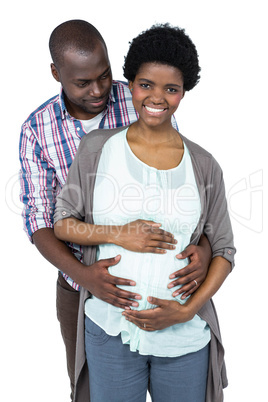 Man touching pregnant womans stomach