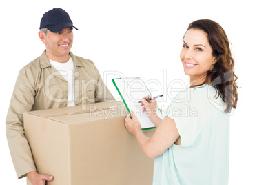 Happy delivery man giving package to customer