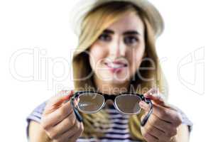 Smiling woman holding glasses