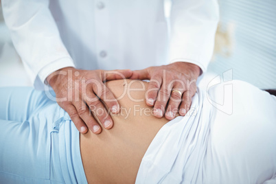 Doctor examining pregnant woman