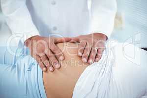 Doctor examining pregnant woman