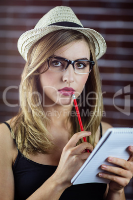 Woman with a pencil and notebook