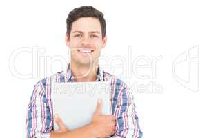 Portrait of smiling male student holding a laptop