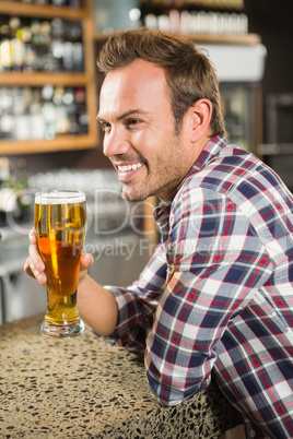 Handsome man having a beer