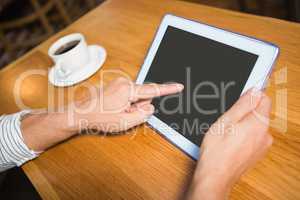 Masculine hands holding tablet