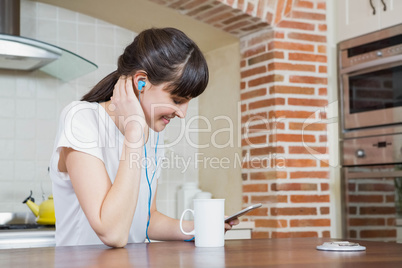 Young woman listening to music on smartphone