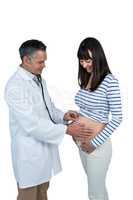 Doctor examining pregnant woman