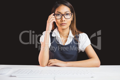 Serious businesswoman holding her eyeglasses