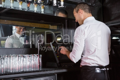 Waiter preparing a bill