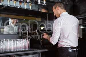 Waiter preparing a bill