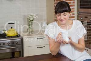 Young woman having a cup of coffee