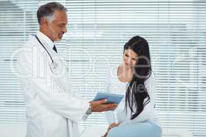 Pregnant woman talking to doctor