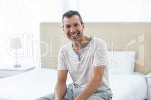 Man sitting on bed