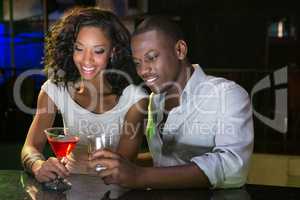 Couple having drinks at bar counter