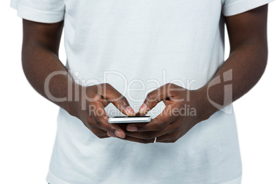 Mid section of man typing a messaging