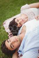 Young couple relaxing on blanket